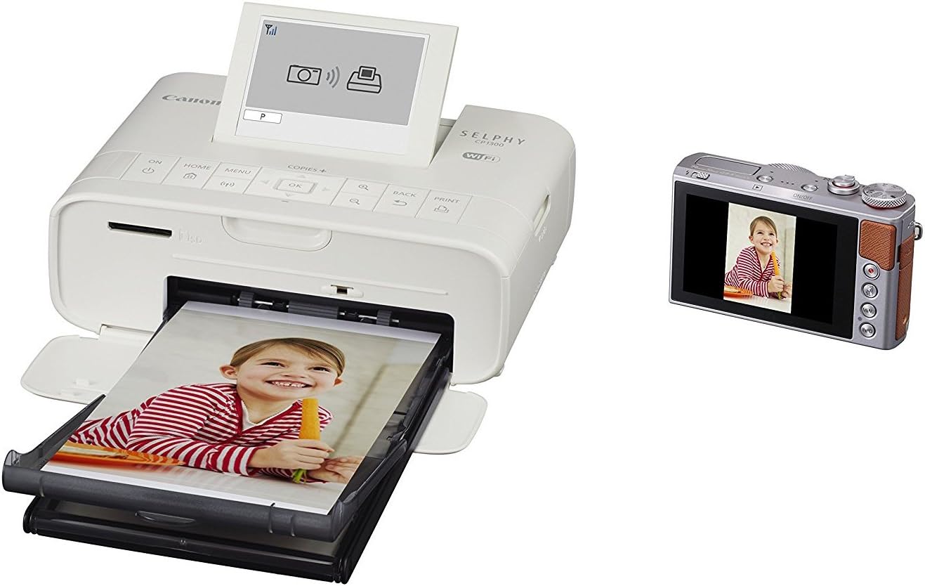 Synopsis: Canon SELPHY CP1300 Wireless Compact Photo Printer (White) + Canon KP-108IN Color Ink Paper Set + USB Printer Cable + HeroFiber Ultra Gentle Cleaning Cloth
